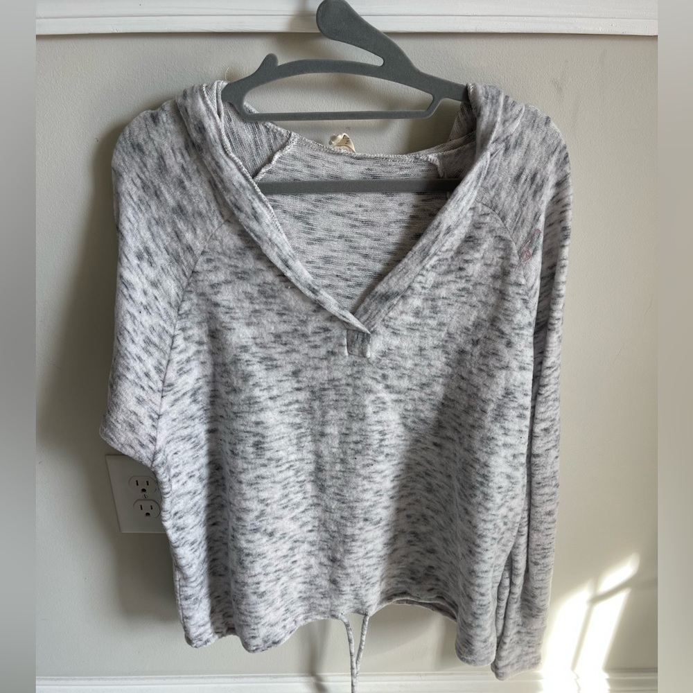 Light sweater with hood, moderately worn.